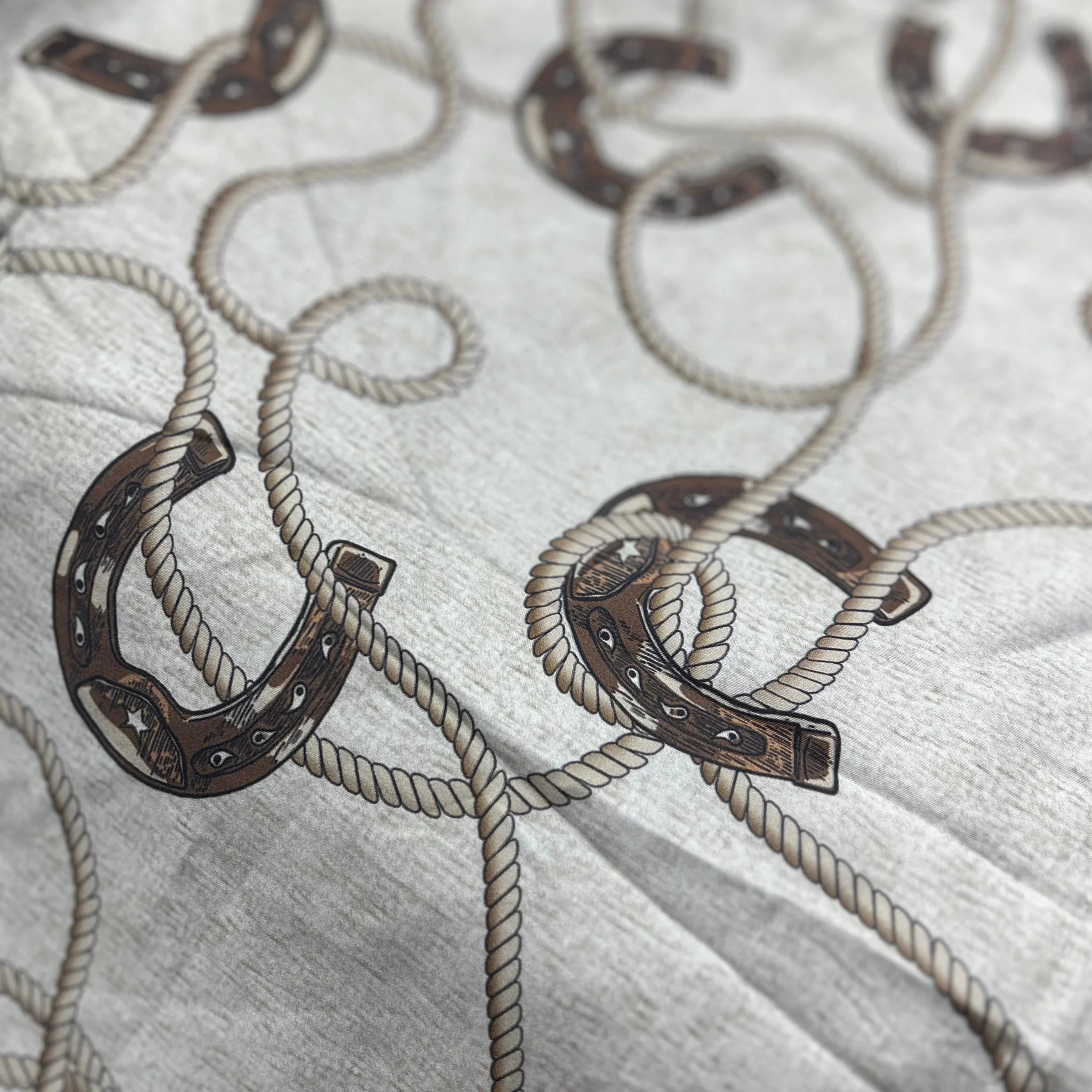 100% cotton duvet and comforter sets featuring brown horseshoes and rope over a cream background detail - Your Western Decor