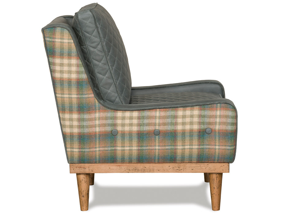 Rustic lodge chair with diamond quilted leather and plaid sides