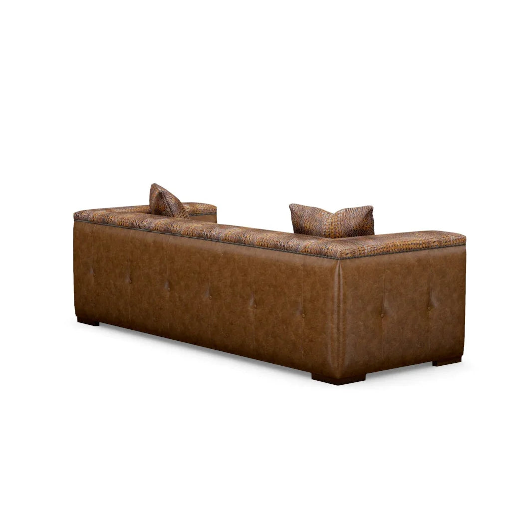 Brown leather sofa with patterned backrest on a white background - Your Western Decor