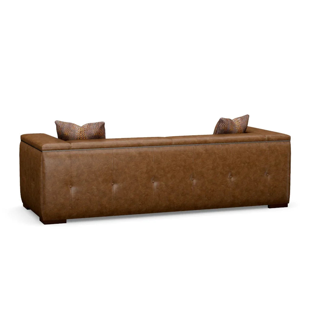 Brown leather sofa with tufted design on a white background back - Your Western Decor