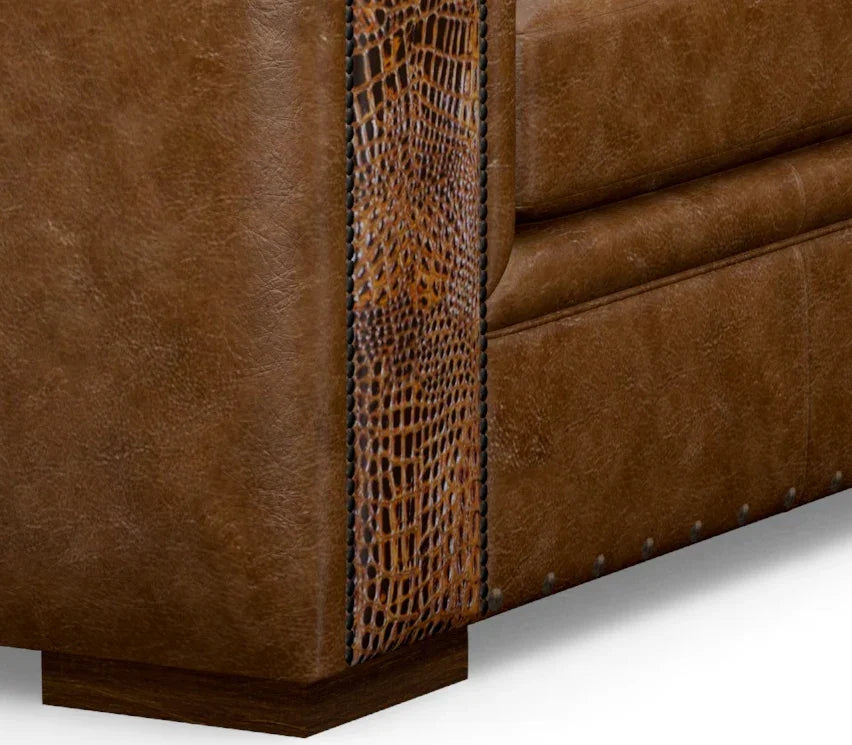 Brown leather sofa with textured corner detail on a white background - Your Western Decor