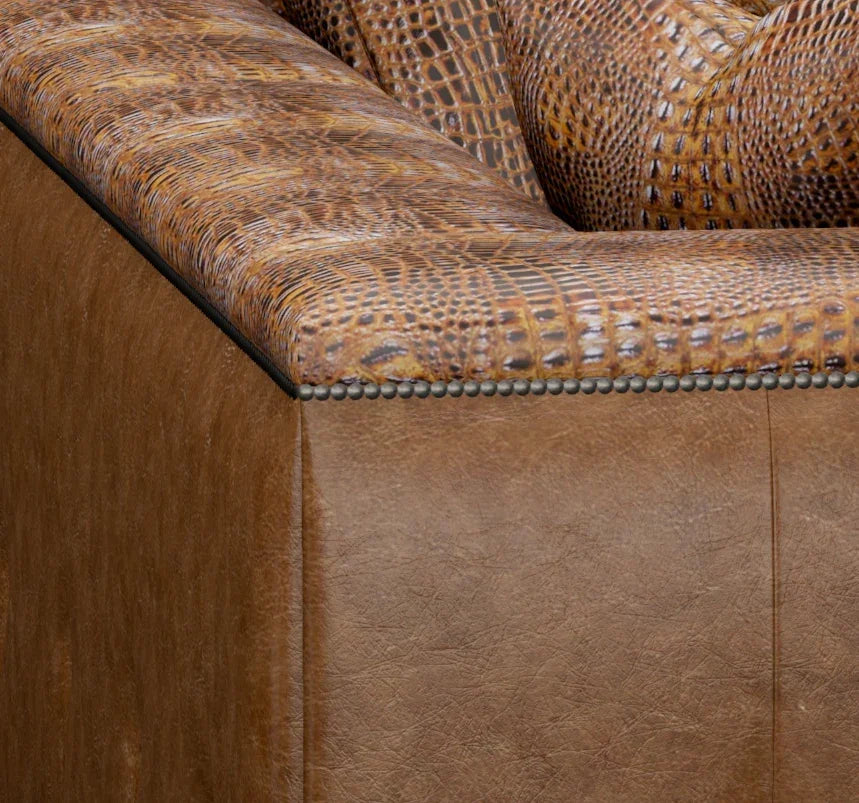 Close-up of a brown leather sofa with textured backrest - Your Western Decor