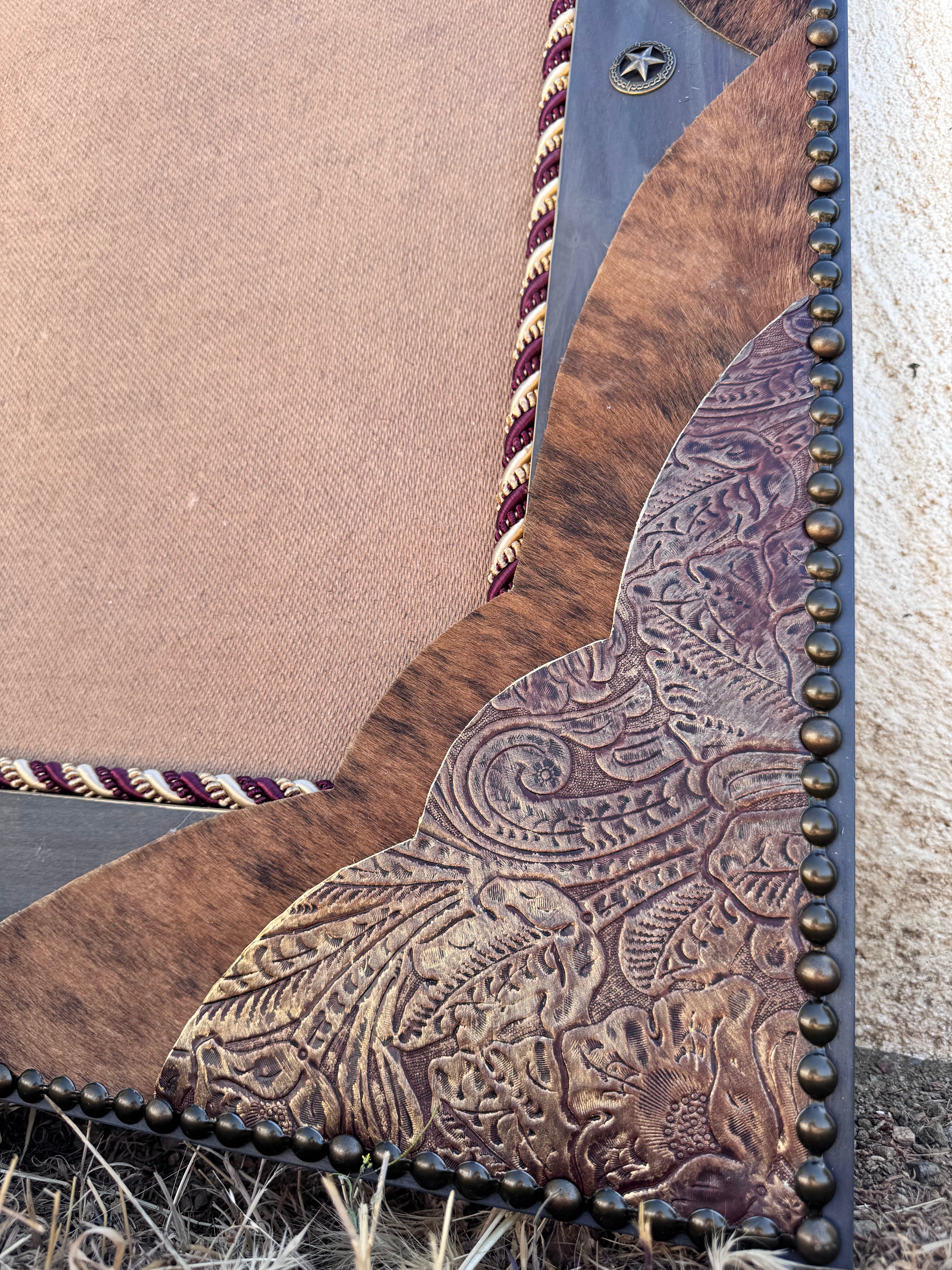 Close of detail of nail trim, leather, and cowhide western mirror corner