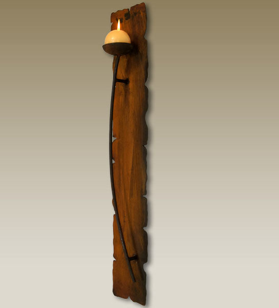 Side view of single iron candle wall sconce
