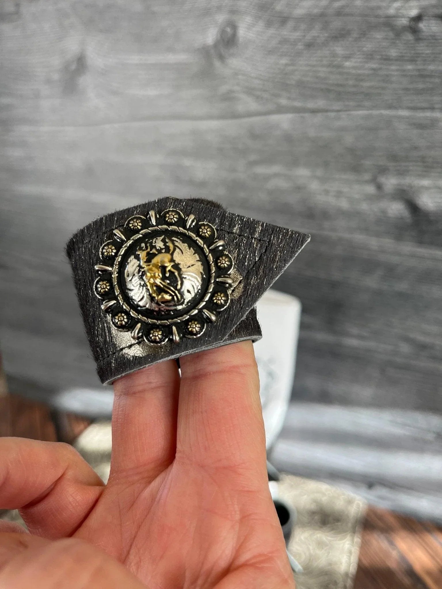 western cowhide napkin ring with rodeo bronc concho cowboy table decor