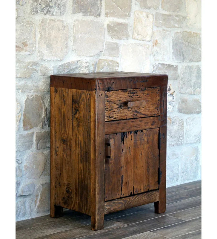 Wooden side table with a rustic design against a stone wall - Your Western Decor