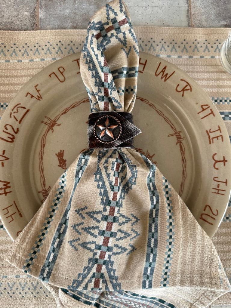 Lonestar concho and cowhide napkin ring on Pendleton napkin - Your Western Decor