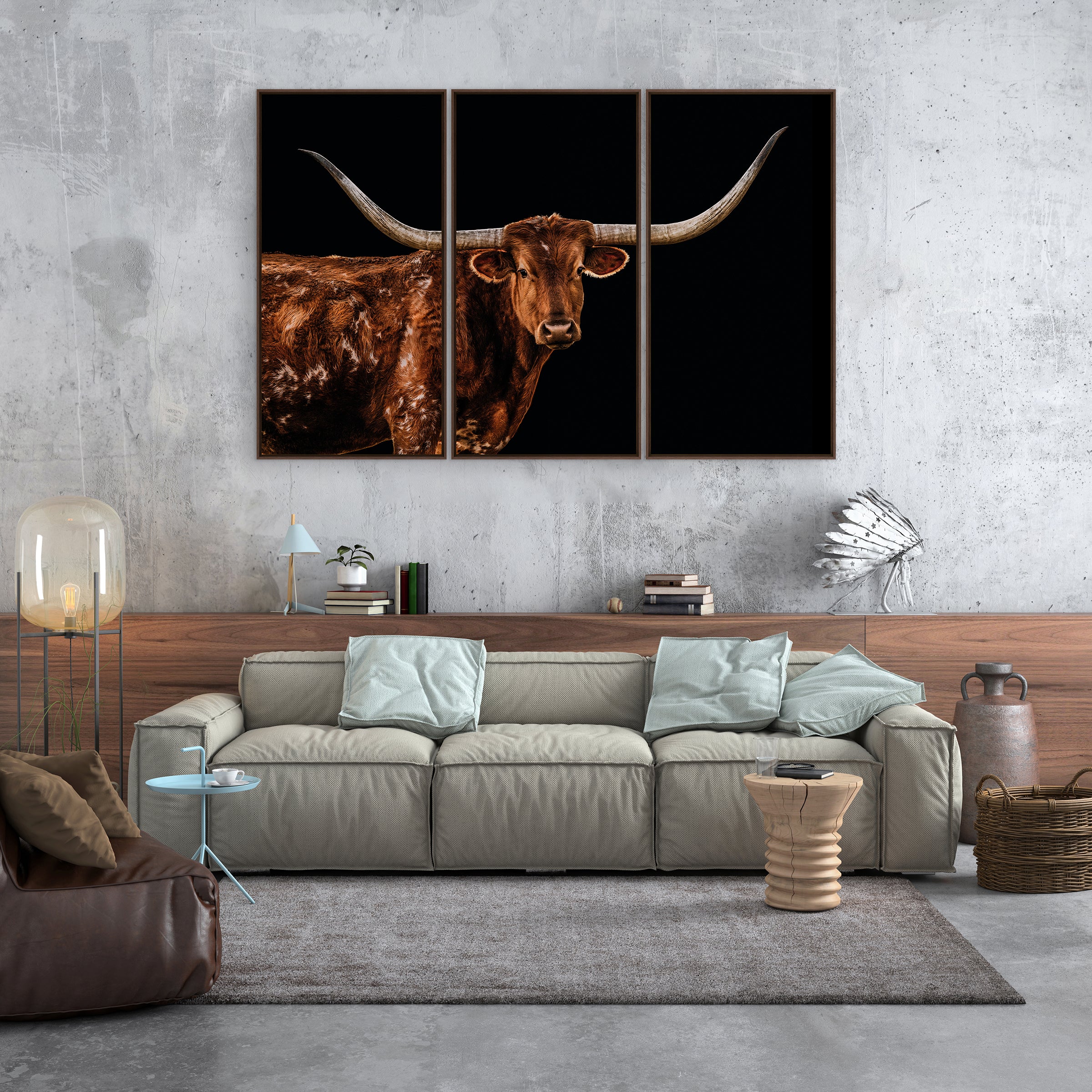 Living room with a large sofa and wall art of a longhorn bull - Your Western Decor