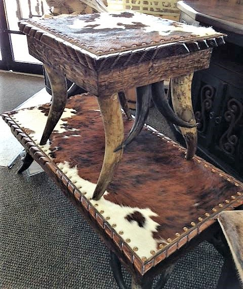 Custom made western coffee table and side table with steer horn legs, cowhide top, and nail head trim