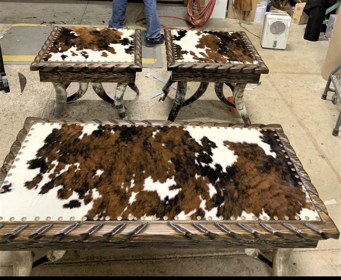 Steer horn leg coffee table and side tables with tri color cowhide tops and nail trim