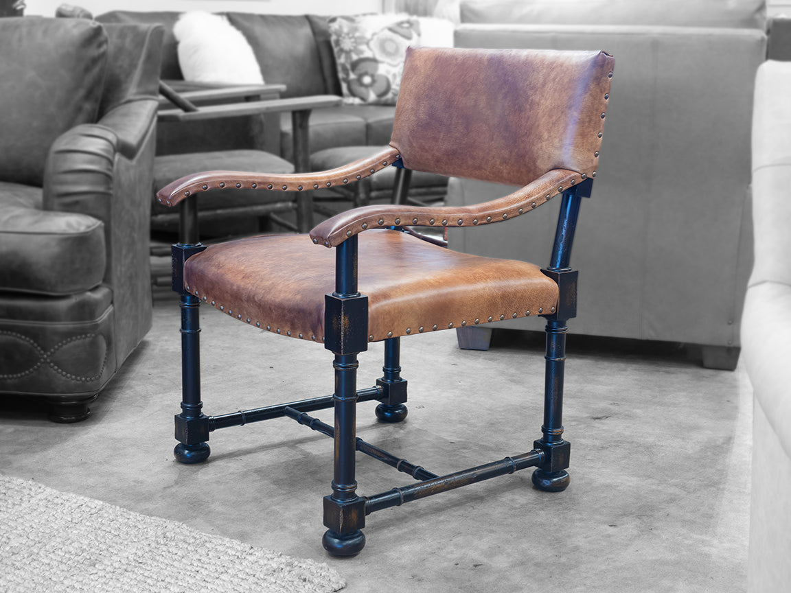 Brown leather accent chair with dark exposed maple wood frame in showroom