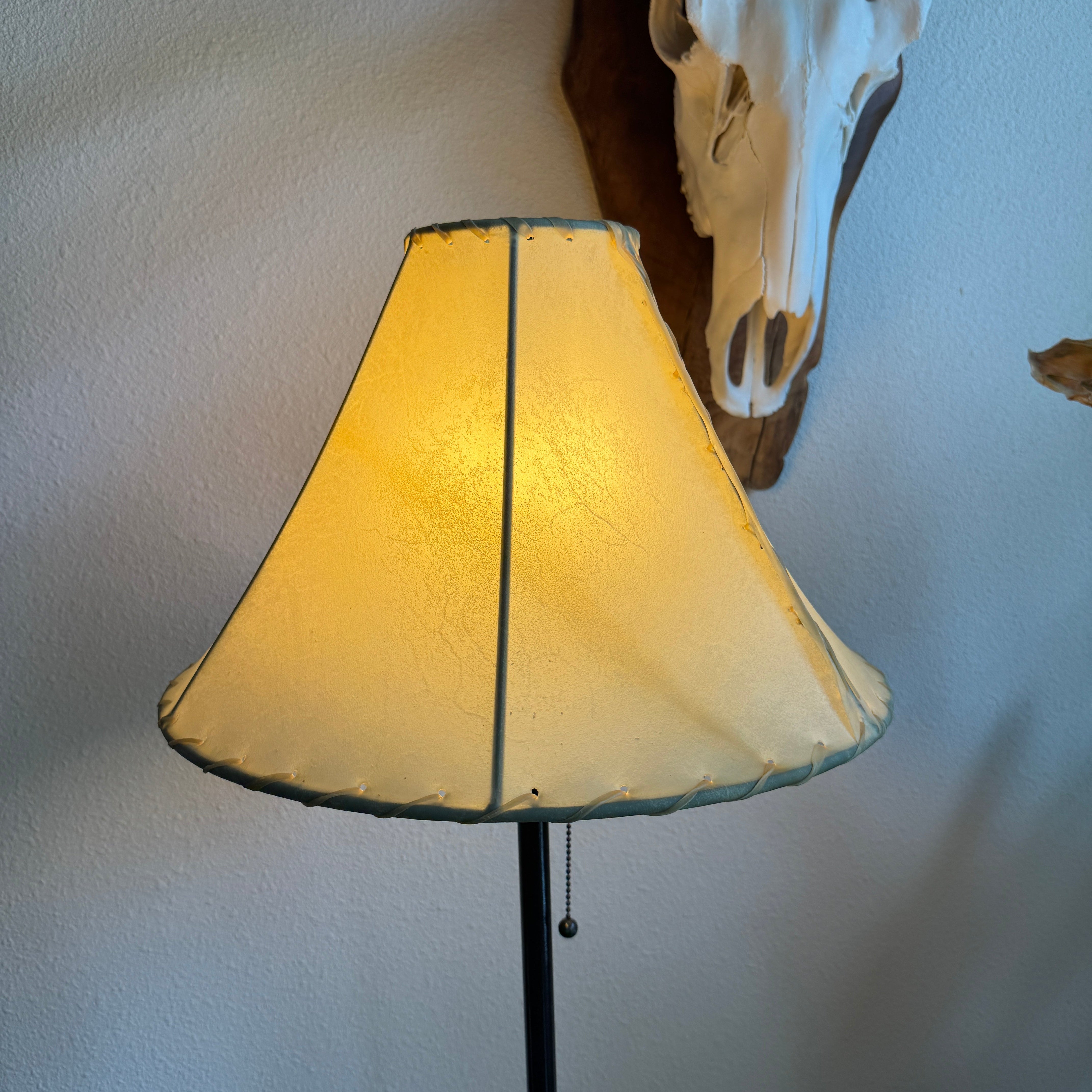 Natural 16 inch round rawhide lamp shade with light on