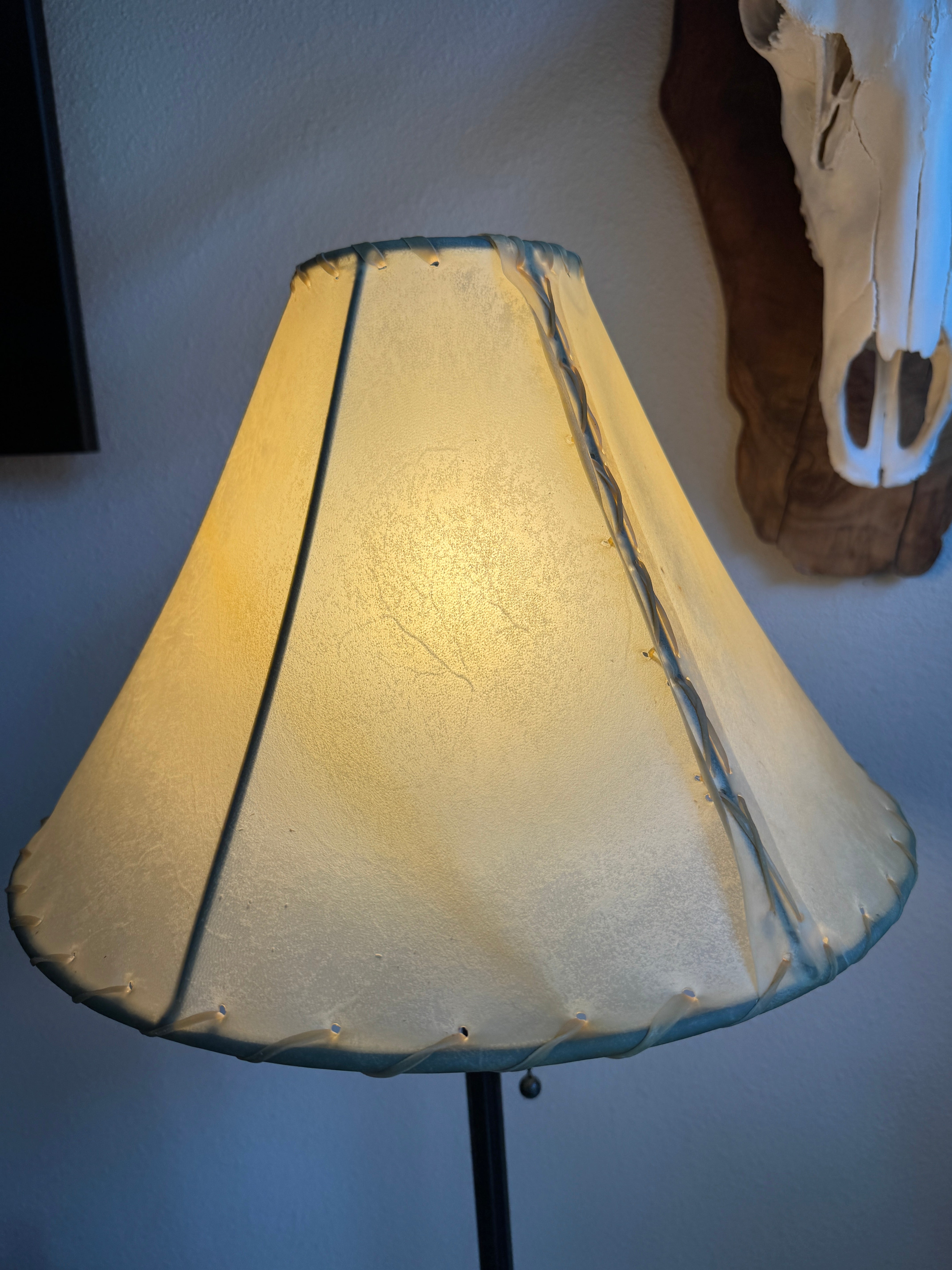 Round natural rawhide lamp shade with light on