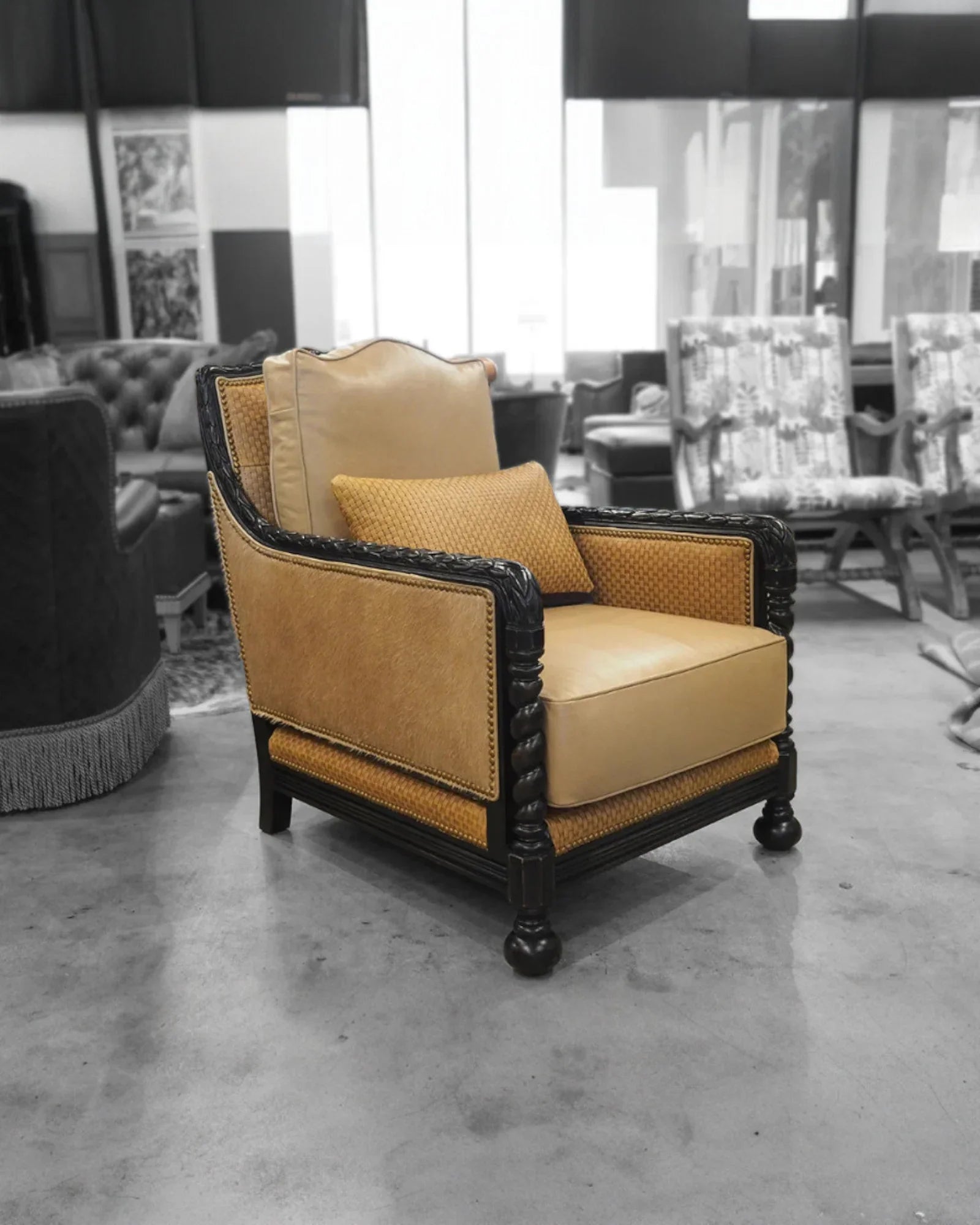 Vintage-style armchair with beige cushion in a showroom setting - Your Western Decor