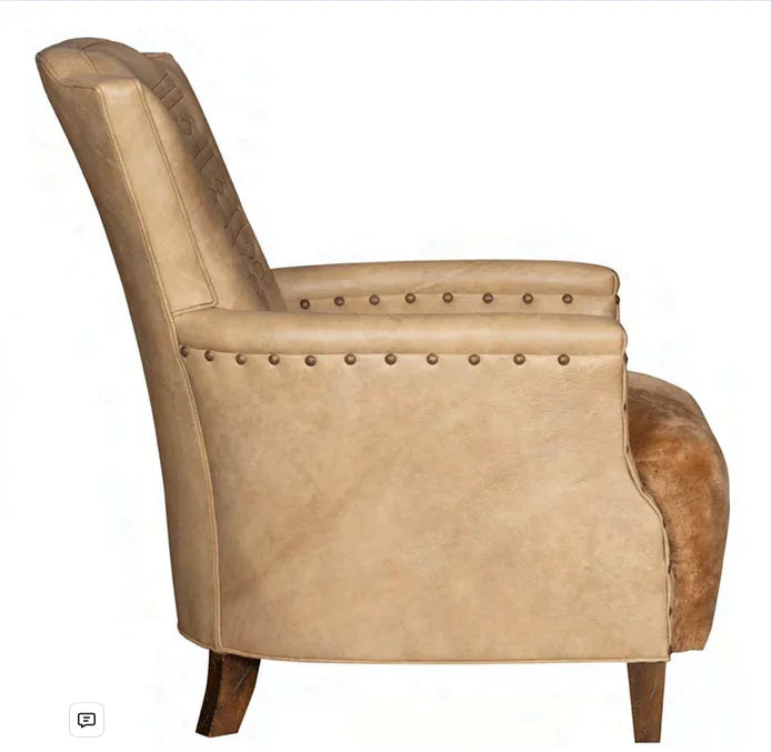 Beige leather armchair with nailhead trim on a white background - Your Western Decor