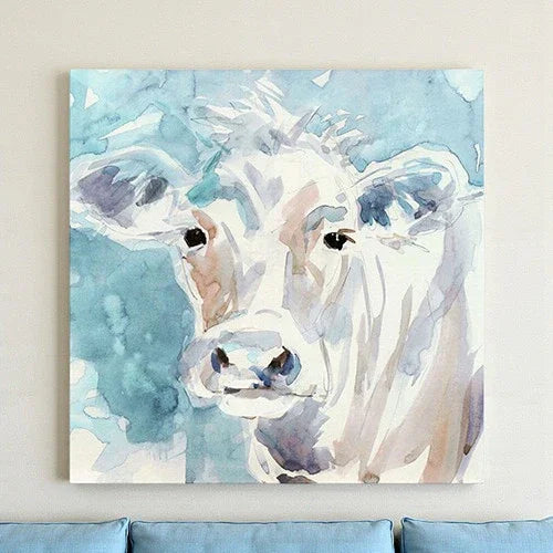 Painting of a cow's face with watercolor textures on a light blue background - Your Western Decor