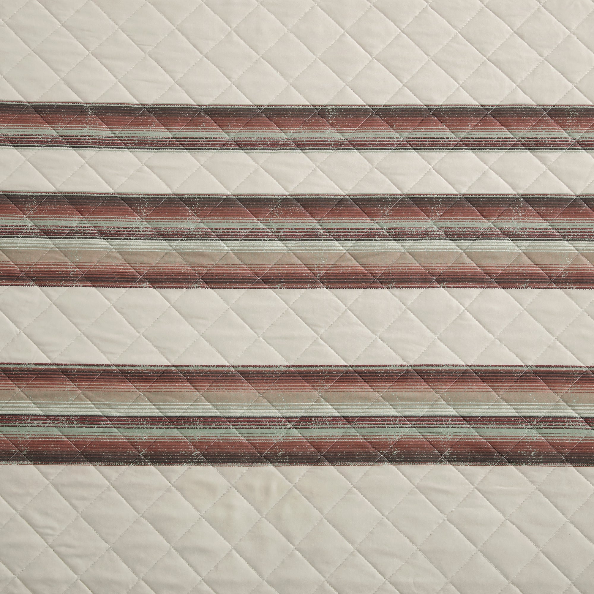 Textured fabric quilt with striped pattern on a neutral background - Your Western Decor