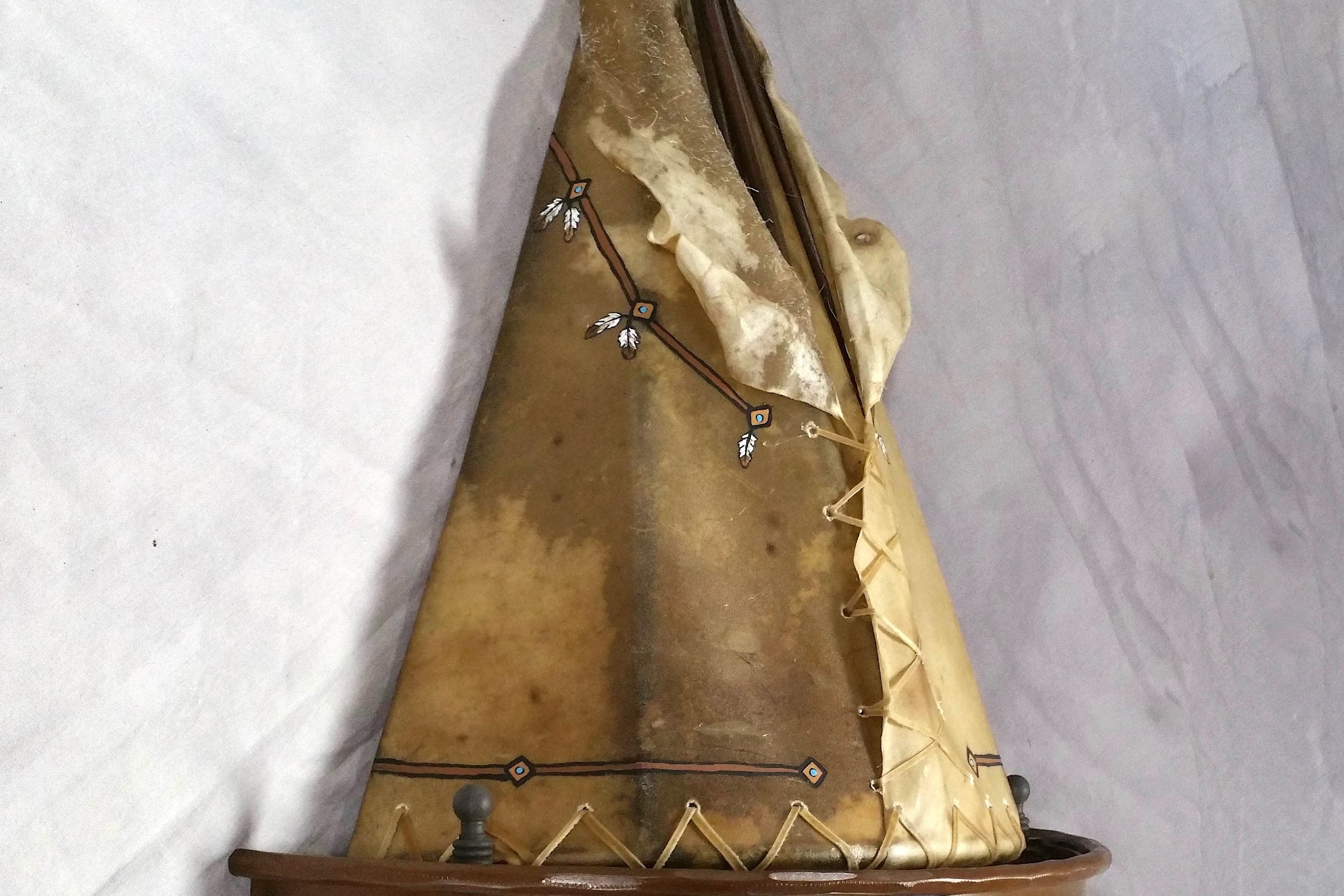 handmade rawhide tipi wall sconce western rustic wall lighting iron concho lodge decor USA made, side view