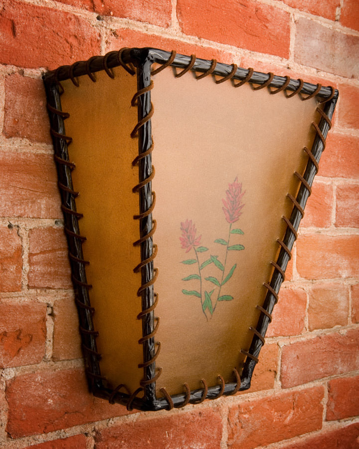 Rawhide and iron wall sconce with leather lacing and hand painted florals