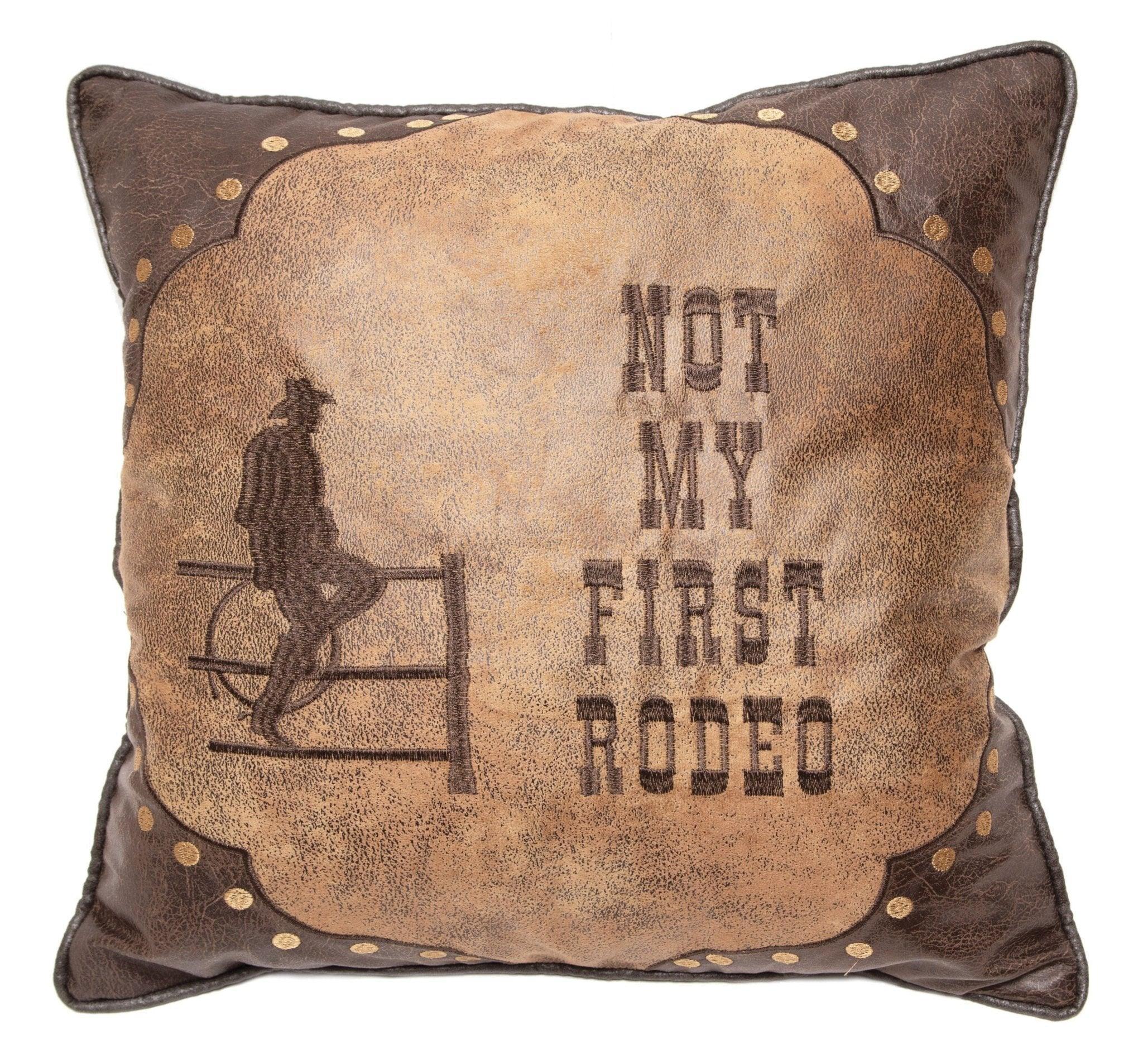Light and dark brown faux leather western throw pillow with embroidered cowboy and Not My First Rodeo - Your Western Decor