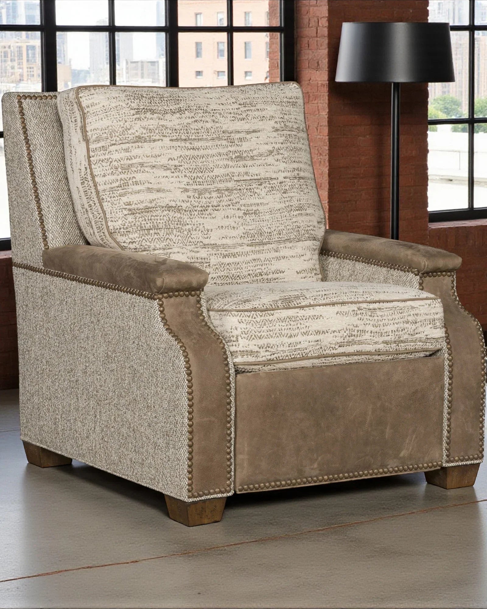 Patterned recliner chair with brown accents in a room with large windows - YOur Western Decor
