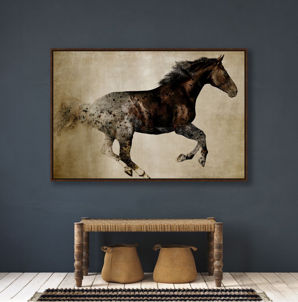 Framed artwork of a running horse on a dark wall above a wooden console table - Your Western Decor