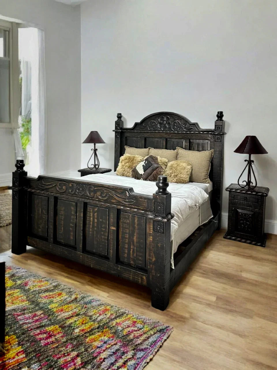 Wooden bed with intricate carvings in a bedroom setting - Your Western Decor