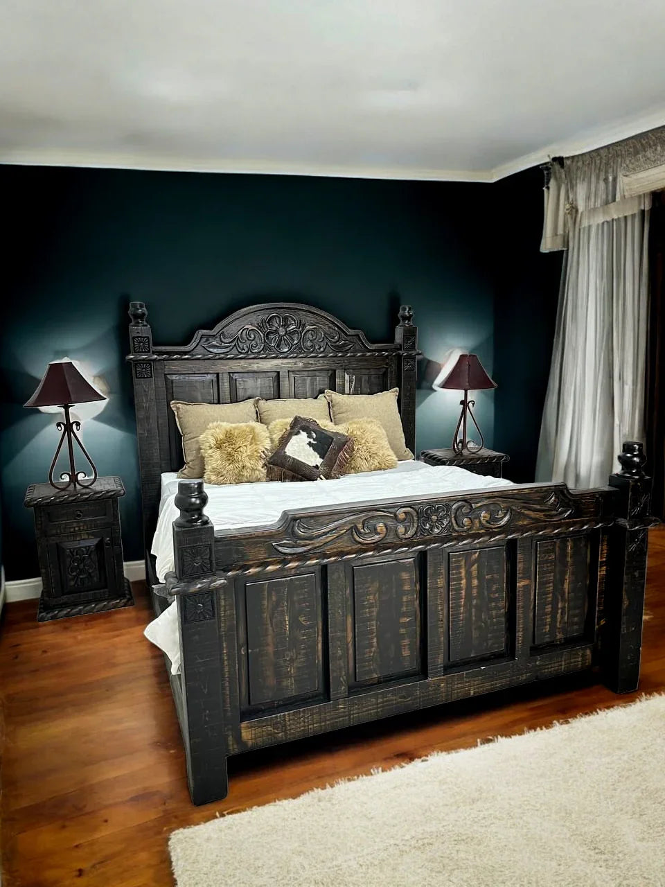 Decorative bedroom with a large wooden bed, nightstands, and lamps. Your Western Decor