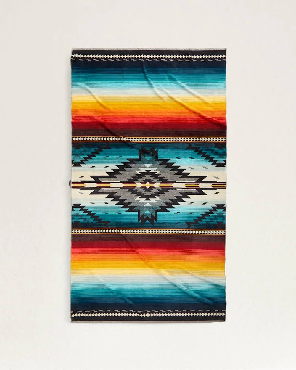 Pendleton Saltillo Sunset Spa & Beach Towel woven from premium cotton velour with the iconic Saltillo pattern.