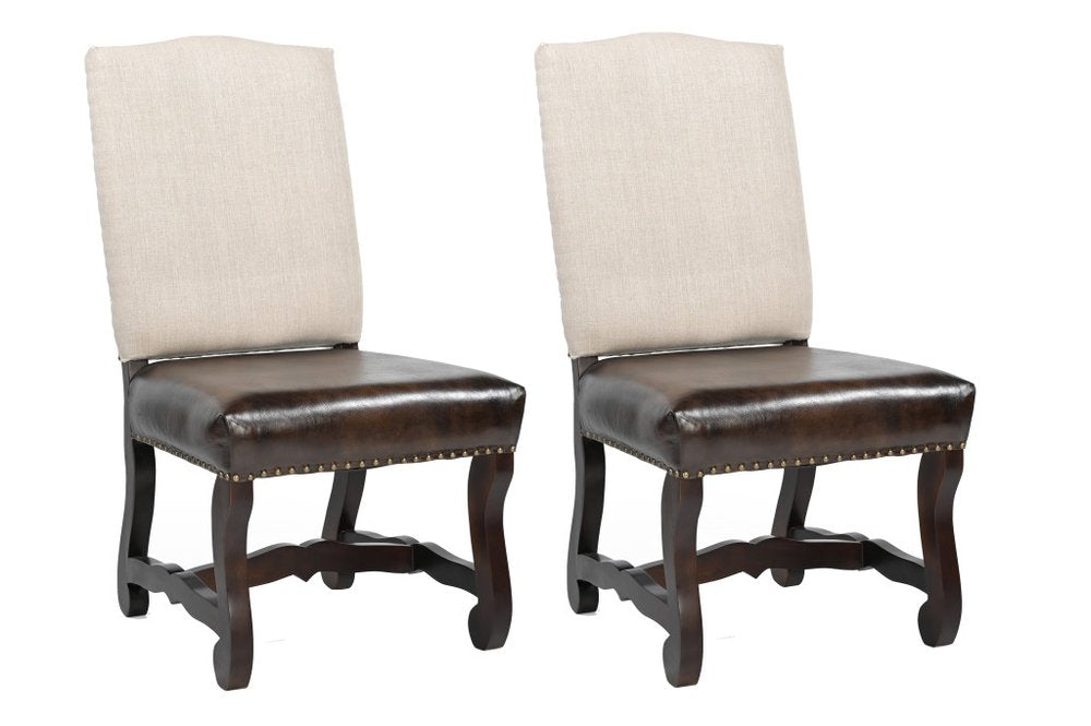Set of two dining chairs with linen fabric backs, leather seats, nail trim, and wood frames