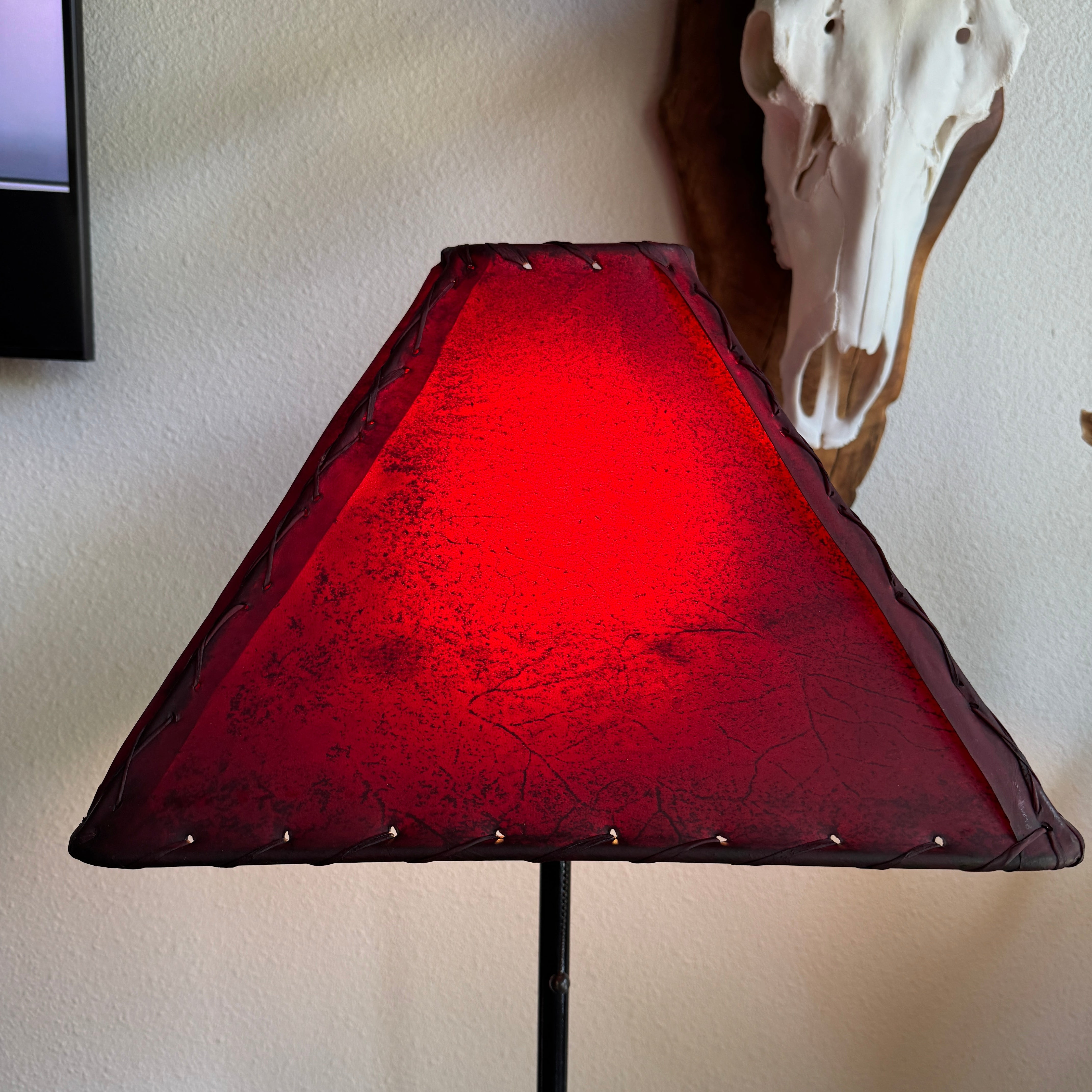 Square rawhide lamp shade with light on