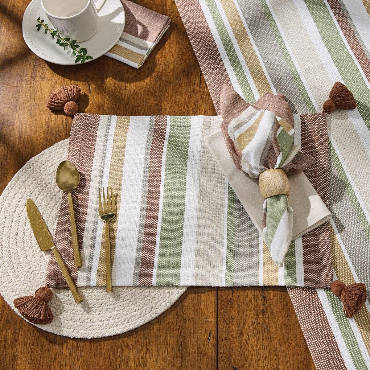 Table setting with striped table runner, napkin, and cutlery on a wooden table - Your Western Decor