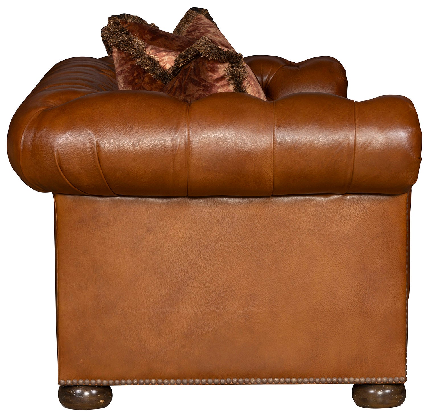 Close-up of Teton Chesterfield leather sofa tufted back and hand-applied nailhead trim