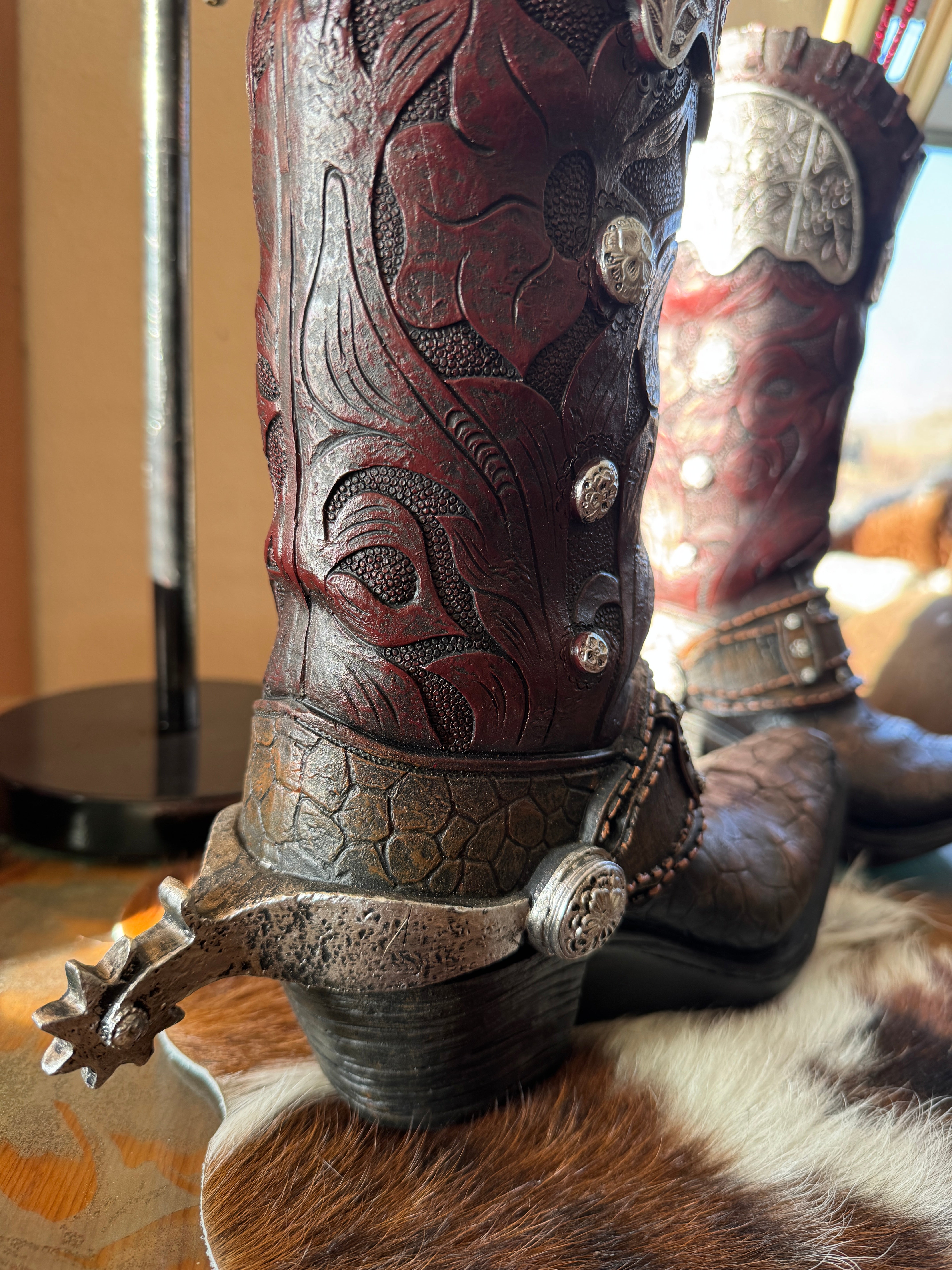 Back view of cowboy boot vase with spur