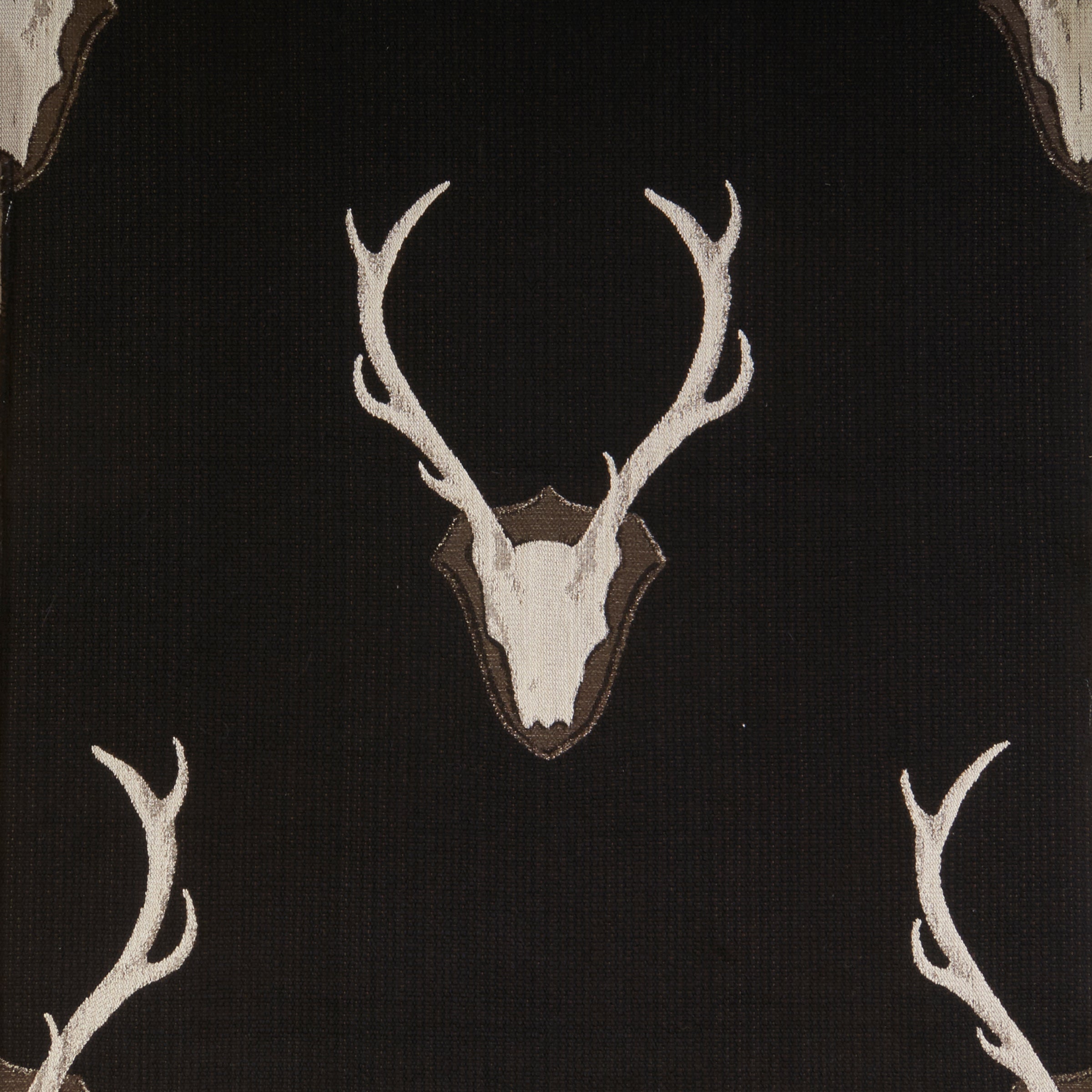 Deer skull design on a black background with antlers.