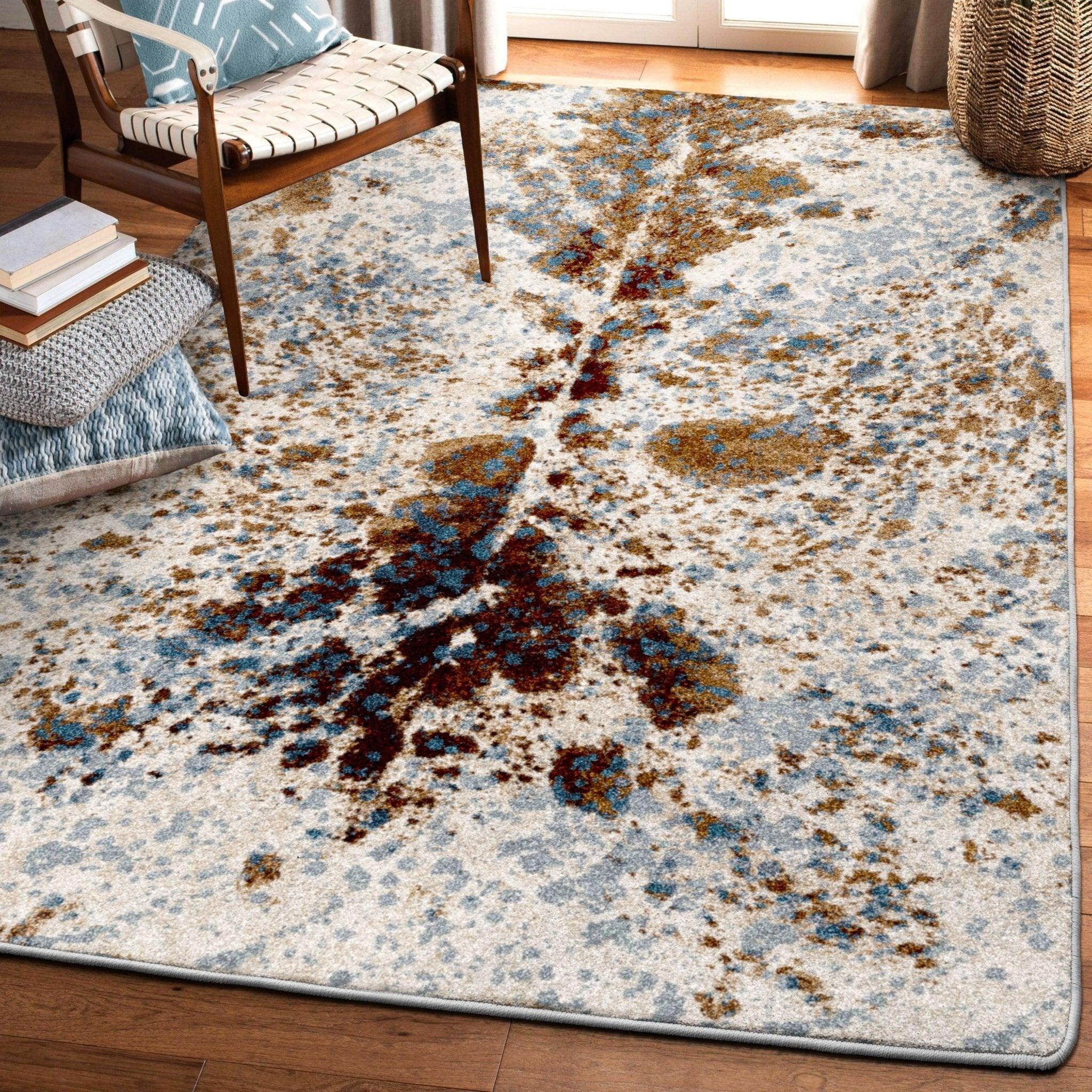 Western area rug with cowhide style longhorn pattern in brown denim and ivory tones for ranch living room