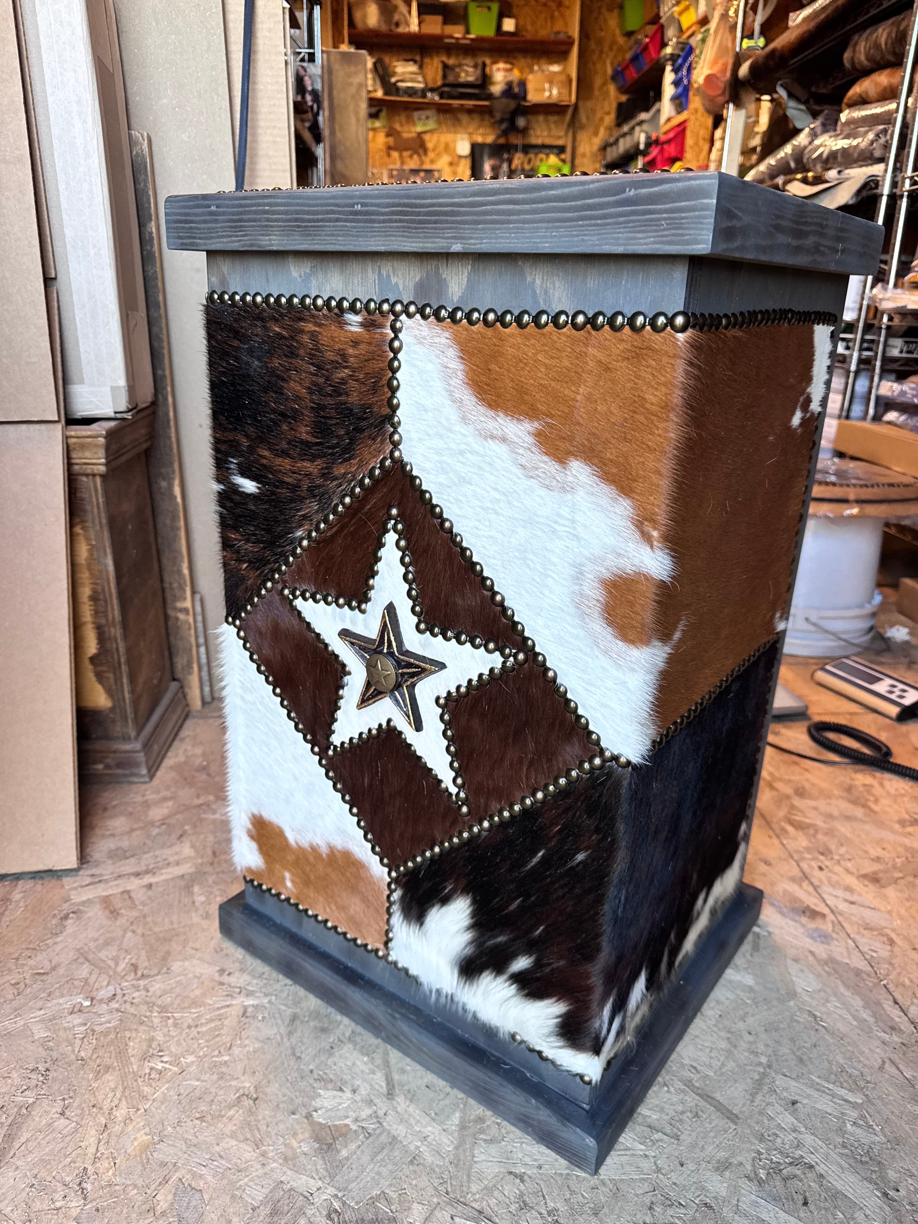 rustic western cowhide storage hamper with nailhead trim and barn wood finish