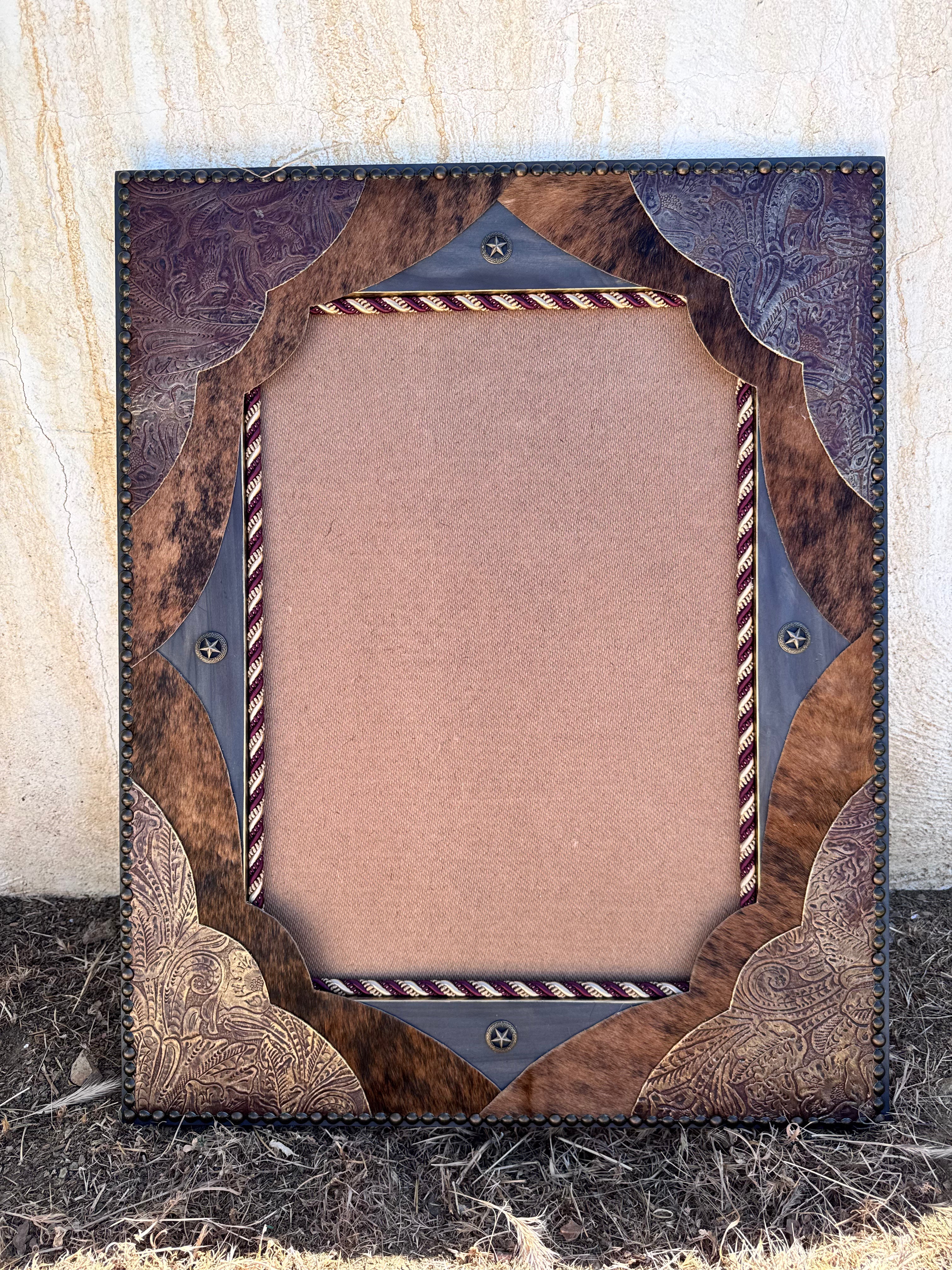 Western mirror with leather and cowhide upholstery, nail trim, with rope and star concho embellishments