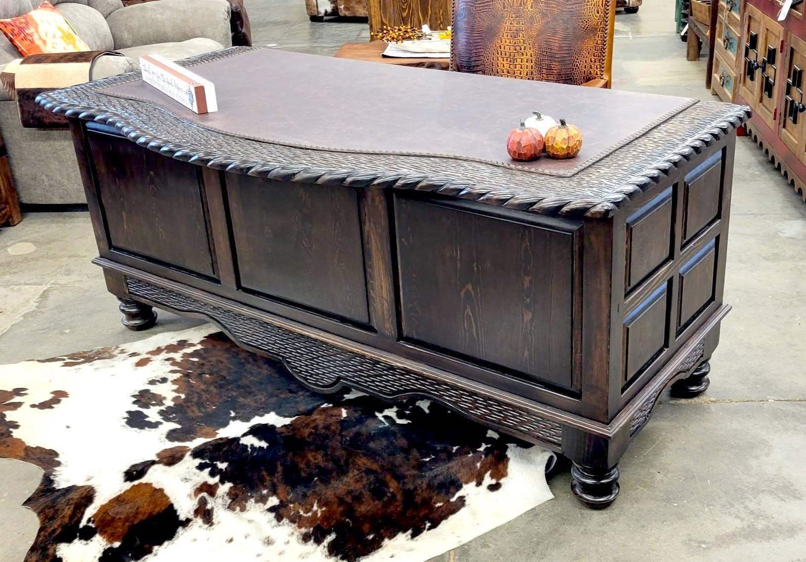 solid alder western executive desk with paneled design and leather top in rustic ranch office with cowhide rug