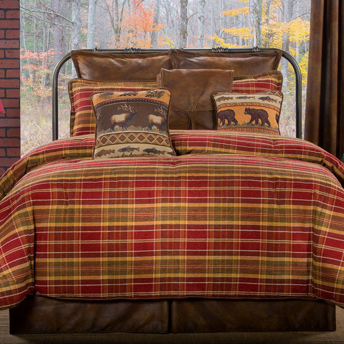 western plaid comforter set in lodge bedroom with red brown bedding wood bed frame and rustic cabin decor