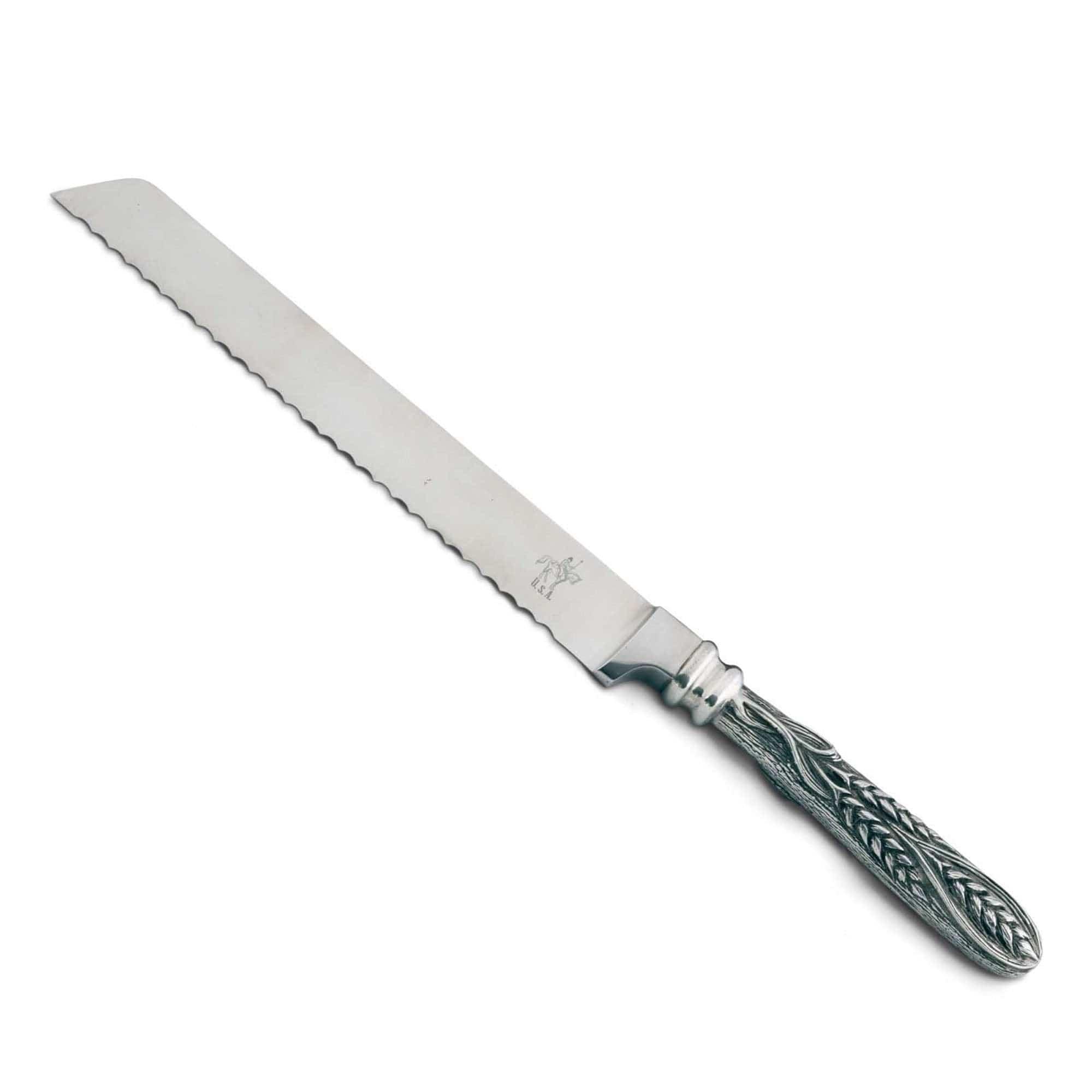 Silver bread knife with decorative handle on a white background