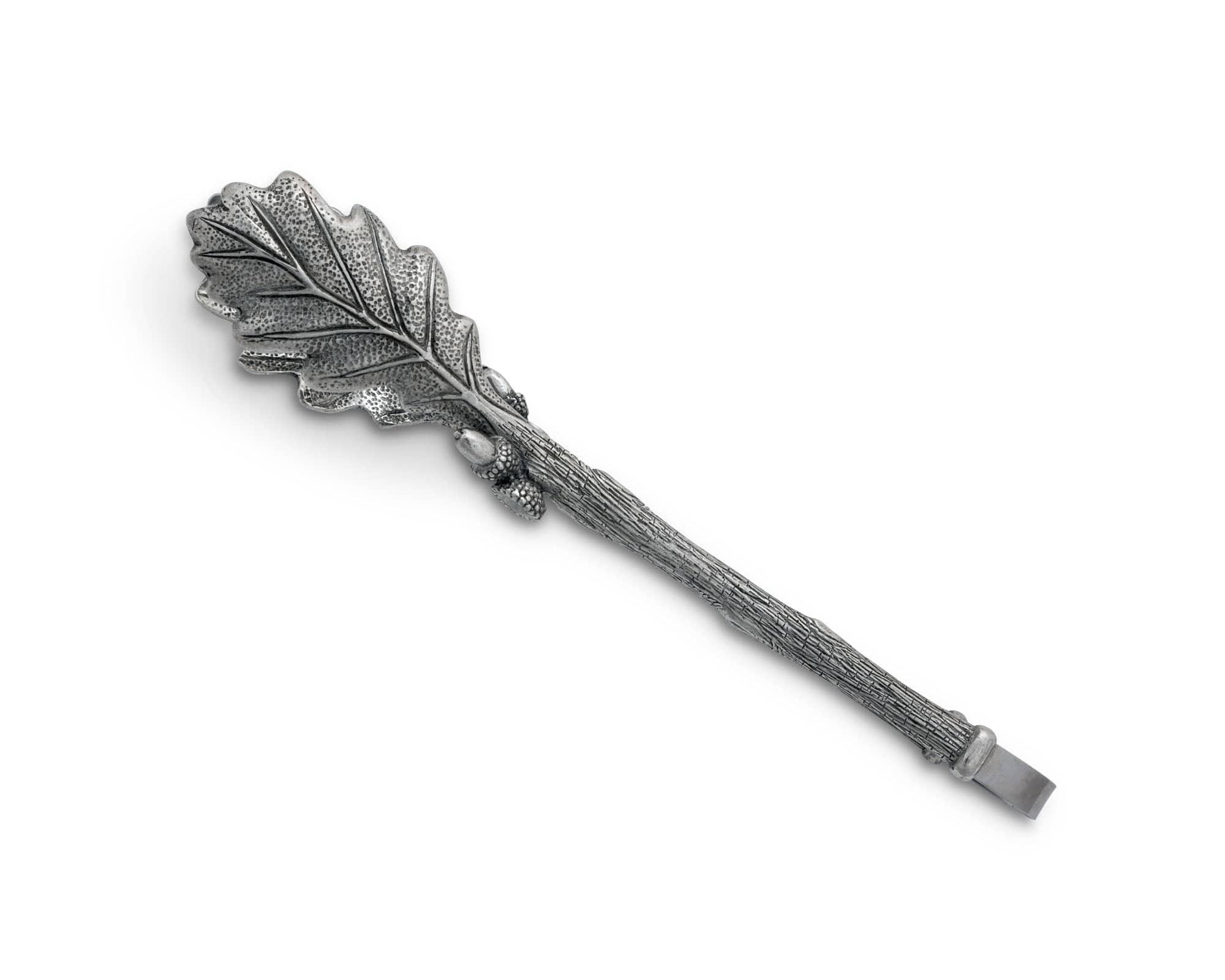 Silver leaf-shaped hairpin on a white background