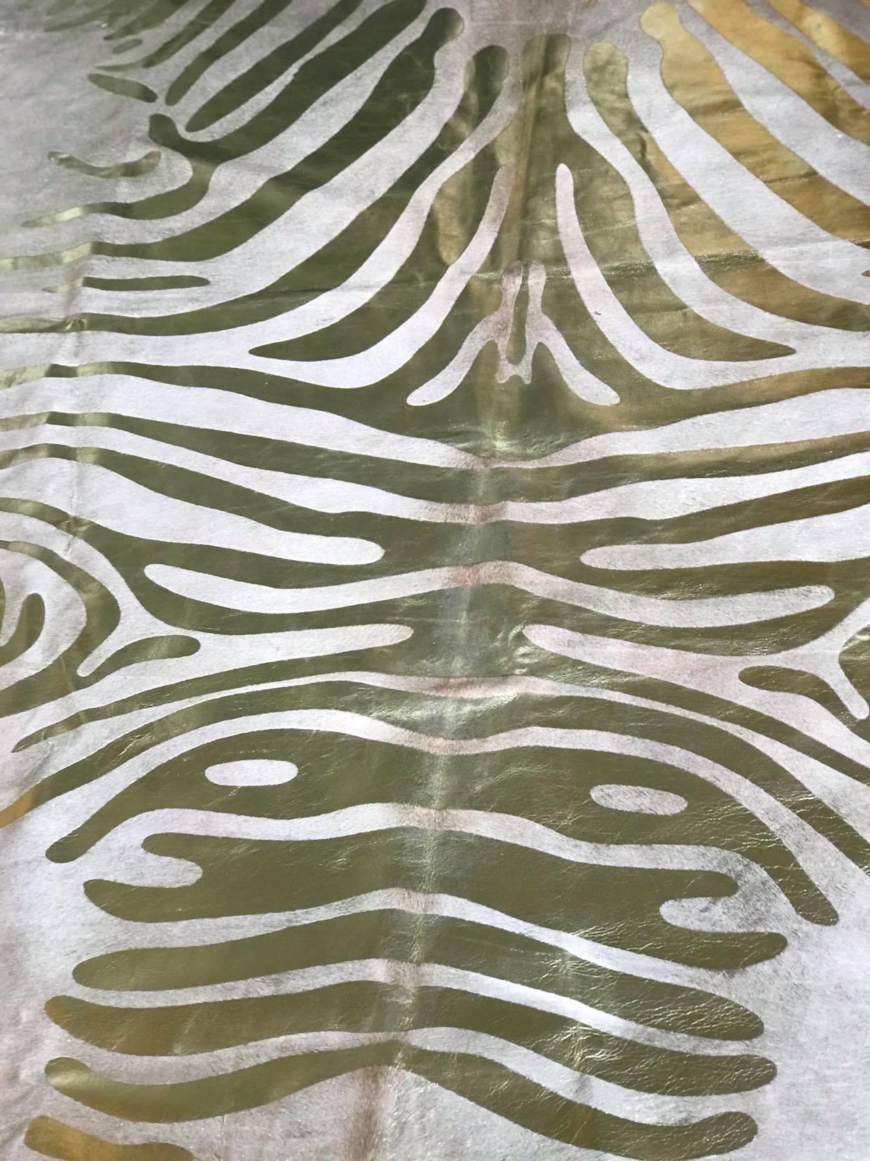 Gold stenciled zebra on beige cowhide rug - Your Western Décor & Design