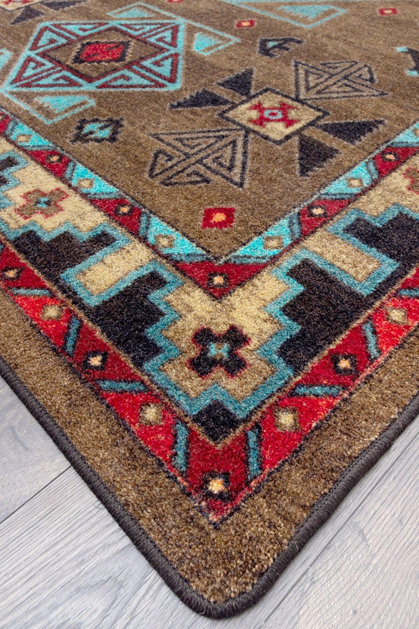 Blue Zircon Southwestern Rug detail in geometric patterns of turquoise, red, beige and black over distressed brown background