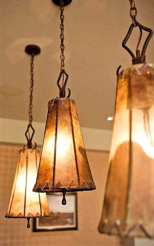 Rustic rawhide pendant lights. Custom made in the USA. Your Western Decor