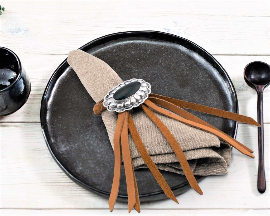 Genuine leather and  pewter concho napkin rings. Your Western Decor
