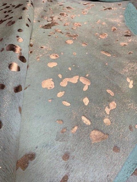 Metallic rose gold acid washed hair on cowhide upholstery - Your Western Decor
