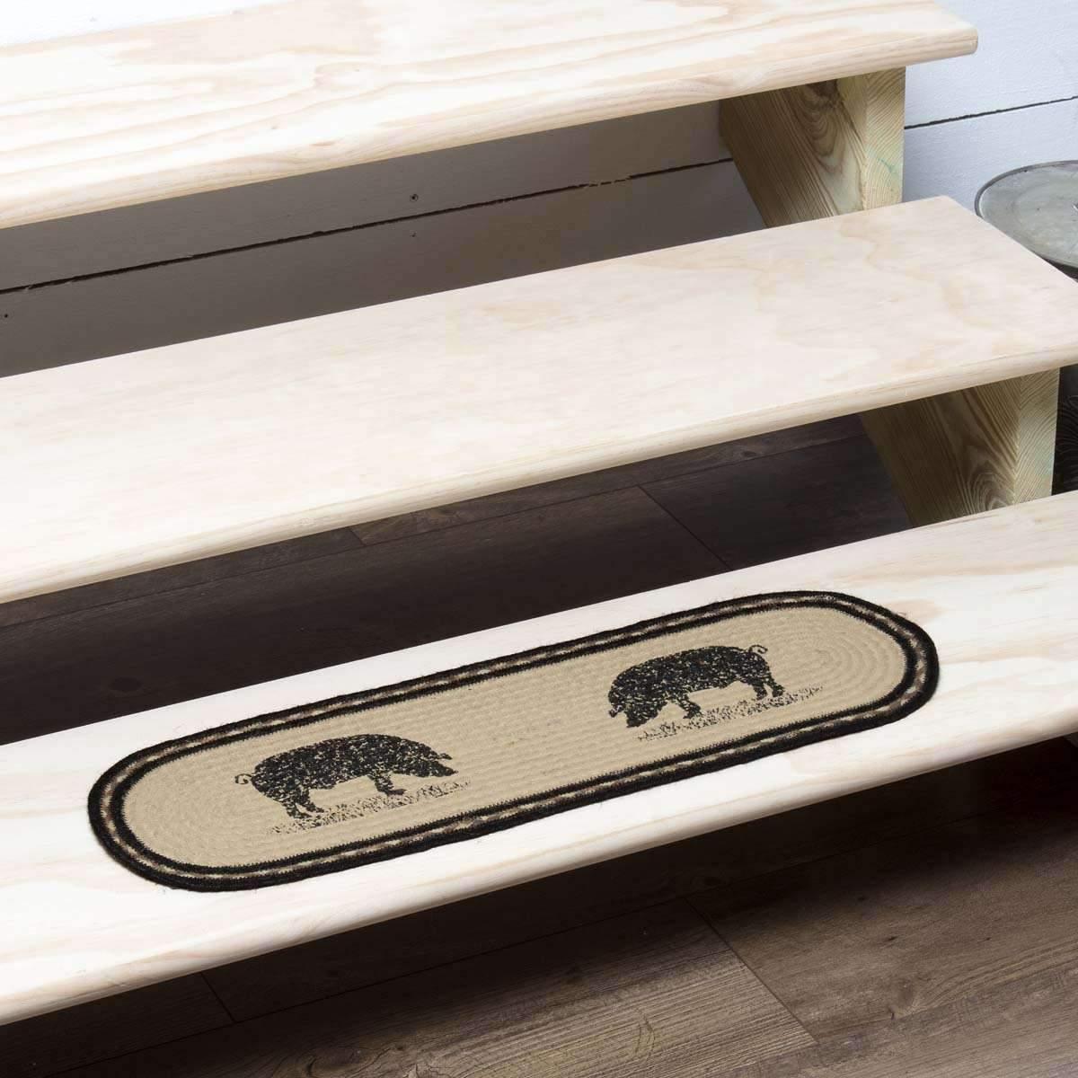 A jute stair tread featuring a farm pig design, with the pig stenciled in distressed black on each end over a solid ivory jute background, machine braided and stitched - Your Western Decor