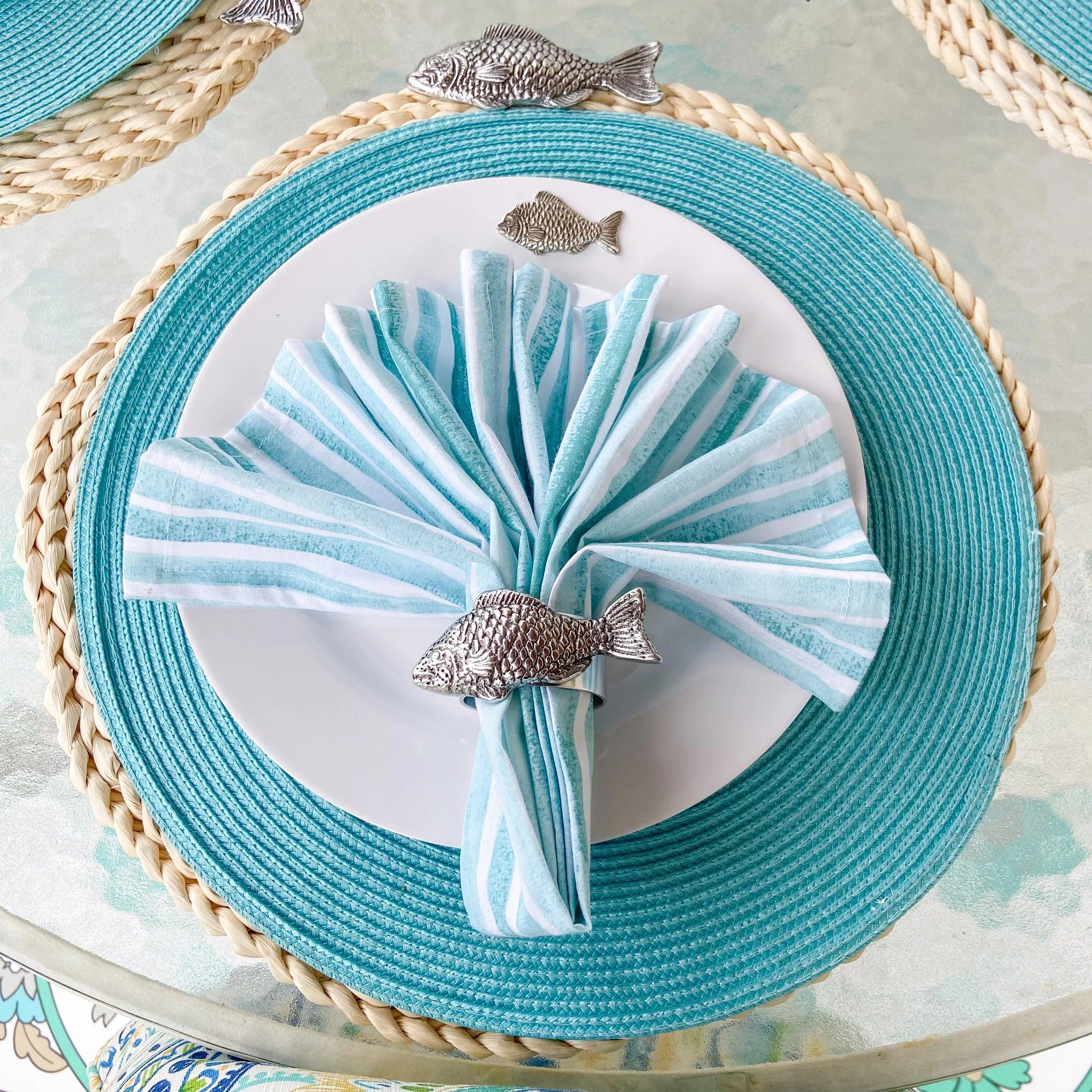 white melamine dinner plates with carved pewter fish on the rim - Your Western Decor