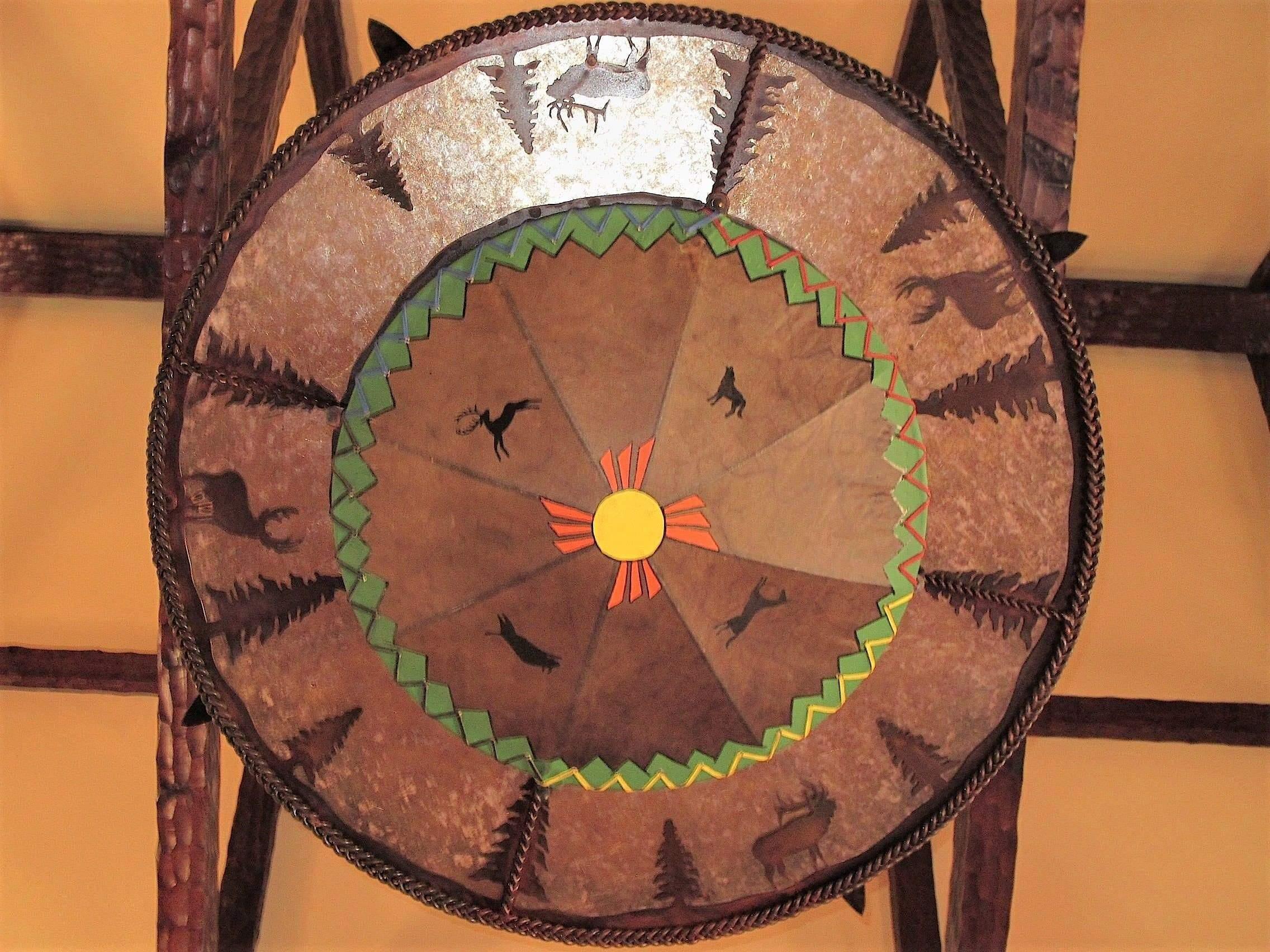 Down-light and mica shade of rustic tipi Coyote Valley chandelier. Your Western Decor, LLC